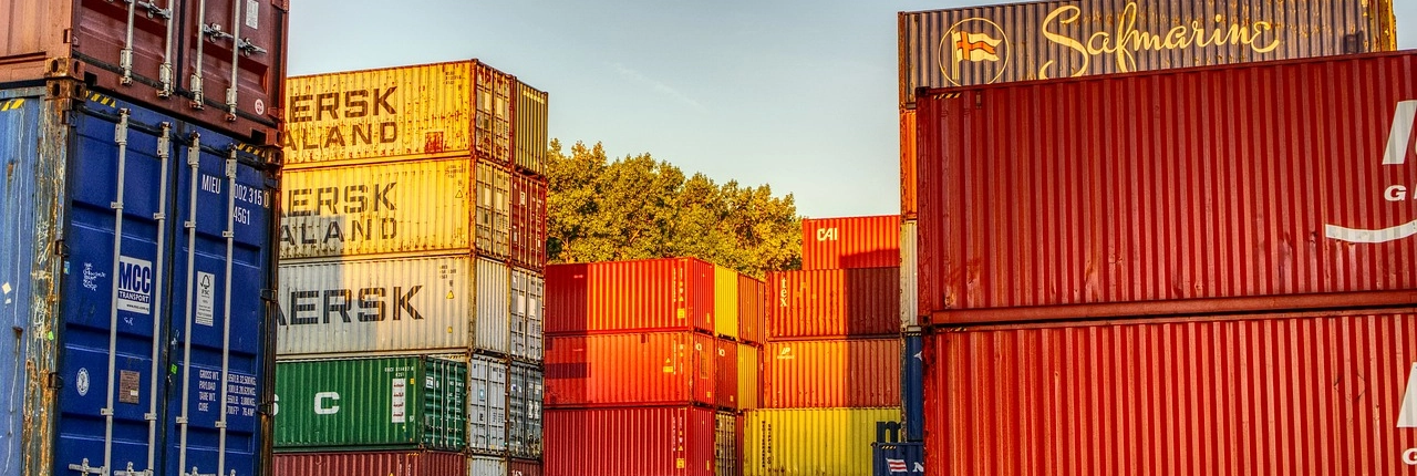 container-3754438_1280 A stack of shipping containers stacked in our yard